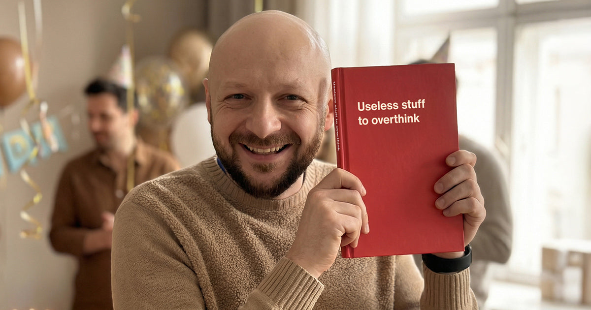 A 50-year-old man celebrating his birthday with a WTF Notebook gift